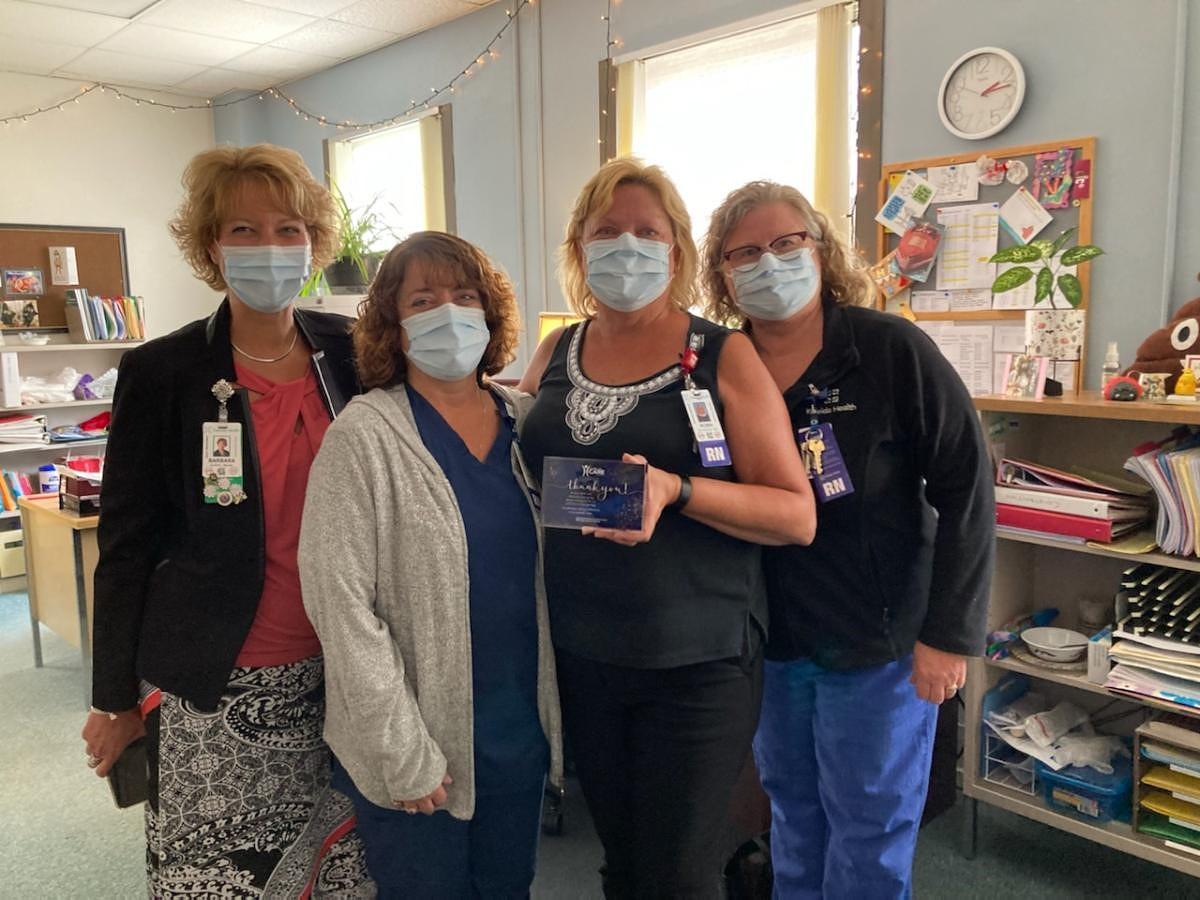 Leading with CARE Award Presented to Robin McLaughlin