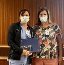 Leading with CARE Award Presented to Brenda Heitzenreiter  